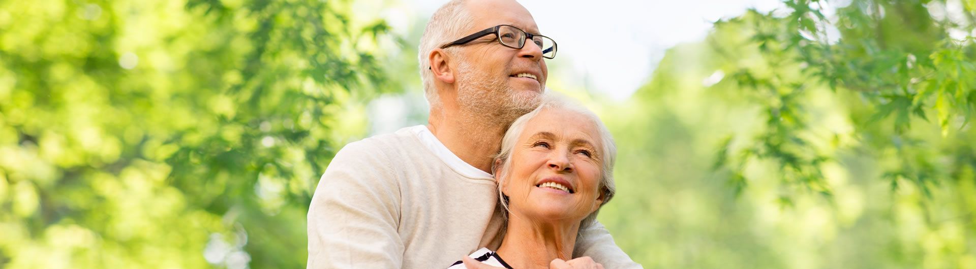 Happy mature couple with natural green background